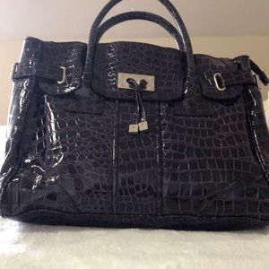 Purple purse with snake skin design